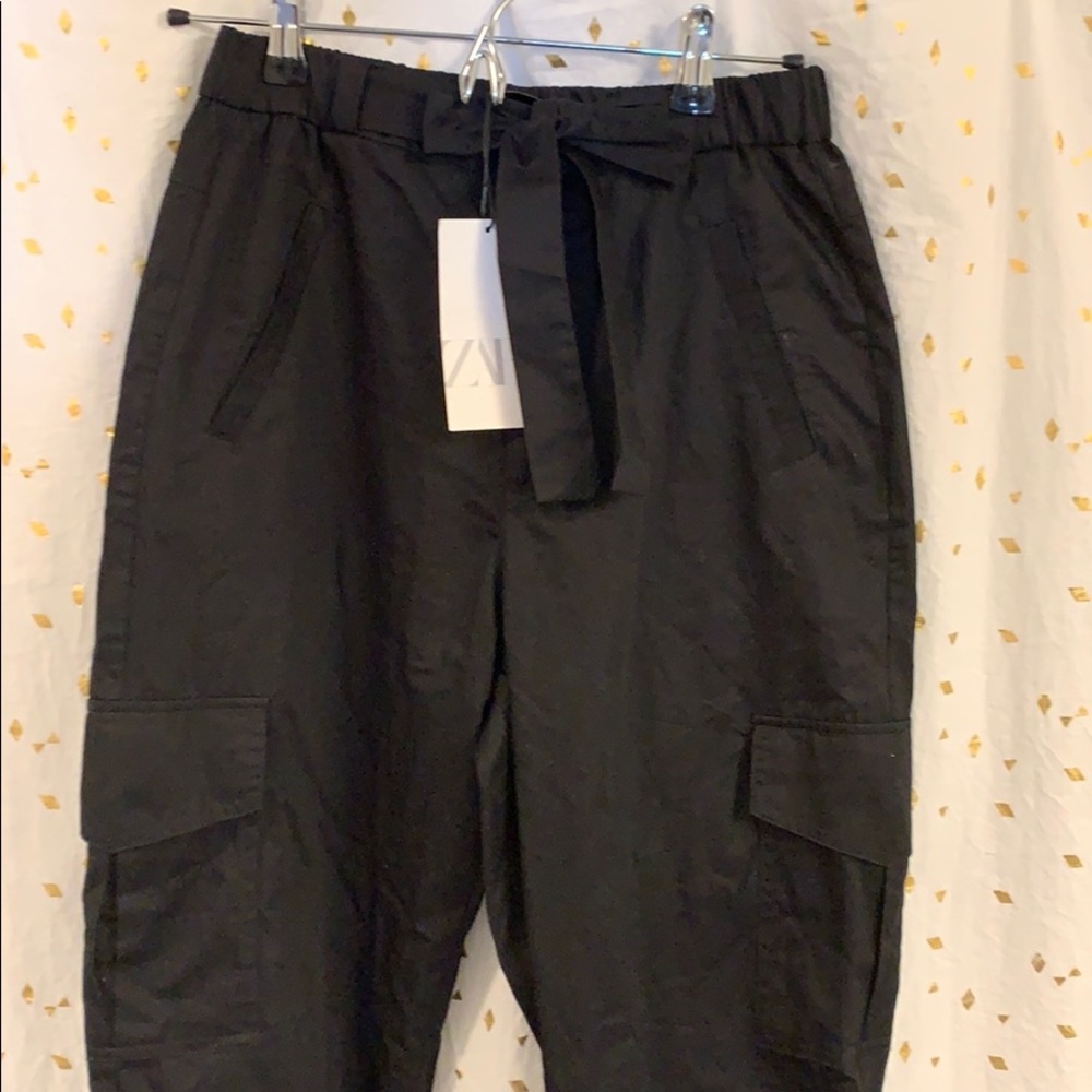 High waisted black pants.